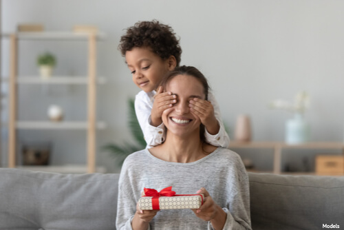 Son giving his mother a gift