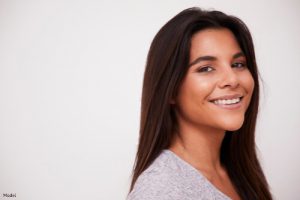 Woman with smooth skin smiling