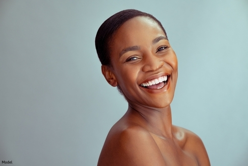 Confident, joyful woman smiling