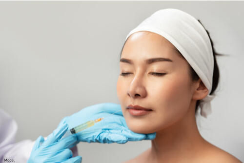 woman receiving dermal filler treatment