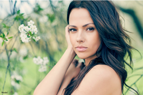 Woman with long black hair outdoors