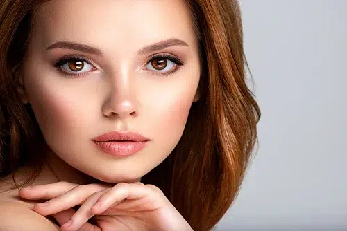 a woman with flawless skin after using Laser Skin Resurfacing - HALO and Secret Pro treatments