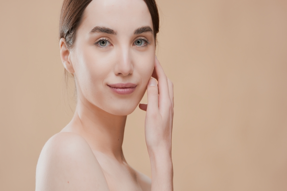 A woman smiling after a microneedling treatment in Mill Valley