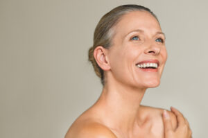 A woman smiling after a HALO laser treatment in Mill Valley, CA