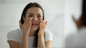 Woman looking at her undereye area after Tixel in Mill Valley